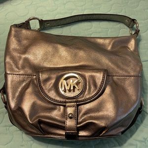 Michael Kors Purse with matching wallet. Purse was used once and wallet is NWT.